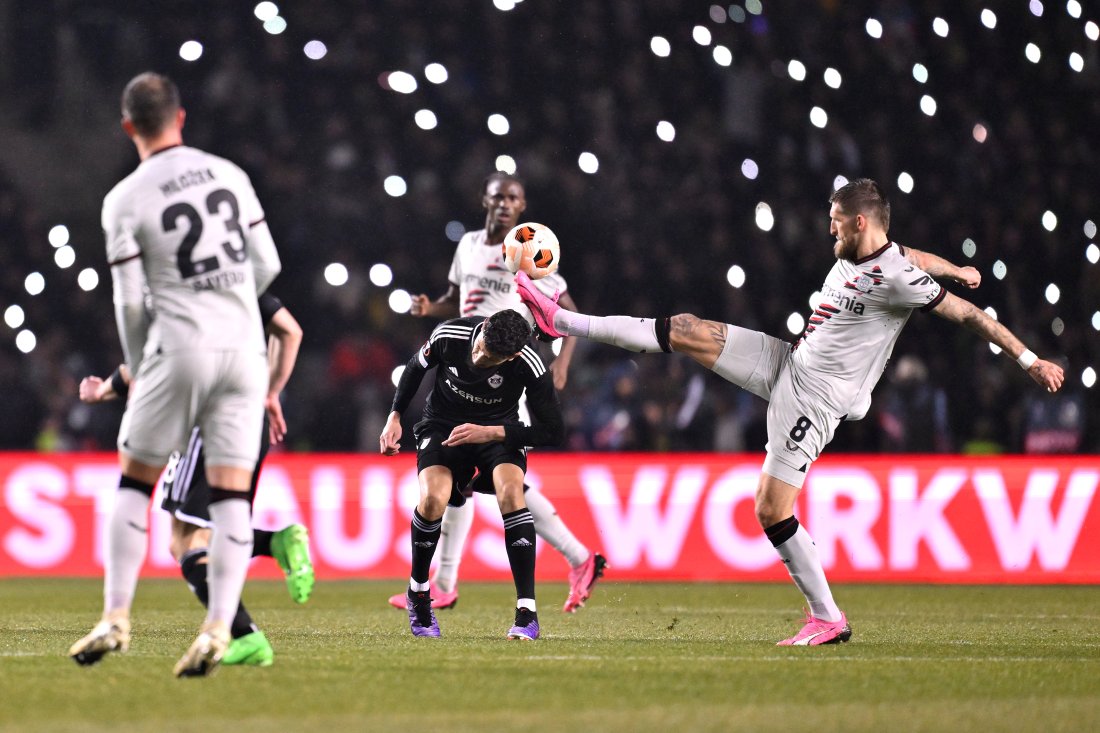 KARABAKH, AZERBAIJAN - MARCH 07: Abdellah Zoubir of Qarabag FK is challenged by Robert Andrich of Bayer Leverkusen during the UEFA Europa League 2023/24 round of 16 first leg match between Qarabag FK and Bayer 04 Leverkusen at Tofiq Bahramov Republican Stadium on March 07, 2024 in Baku, Azerbaijan. (Photo by Oliver Hardt - UEFA/UEFA via Getty Images)